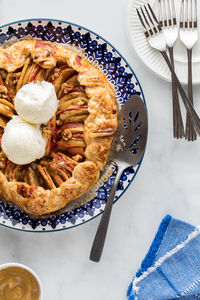 A salted caramel apple galette served with vanilla ice cream.