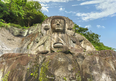 Giant buddha daibutsu of nihonji temple on the mountain sides of mount nokogiri stone quarry.
