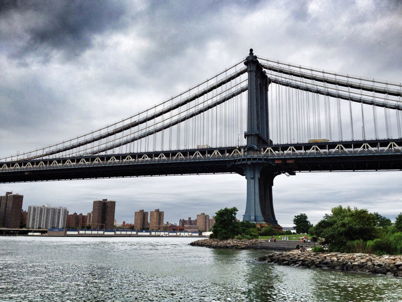 architecture, connection, bridge - man made structure, built structure, water, engineering, river, suspension bridge, sky, bridge, famous place, city, international landmark, waterfront, travel destinations, transportation, cloud - sky, low angle view, capital cities, travel