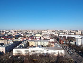 High angle shot of townscape against blue sky