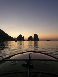 Scenic view of sea against clear sky during sunset