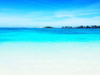 Scenic view of sea against blue sky