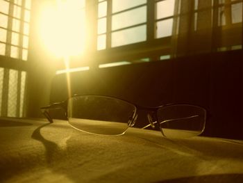 Close-up of sunglasses on glass window