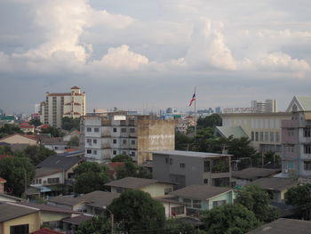 Buildings in city against sky