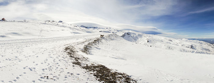 Scenic view of snowcapped mountain against sky