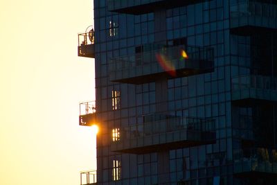 Low angle view of building against sky at sunset