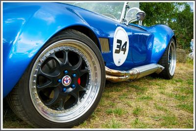 Close-up of vintage car on land