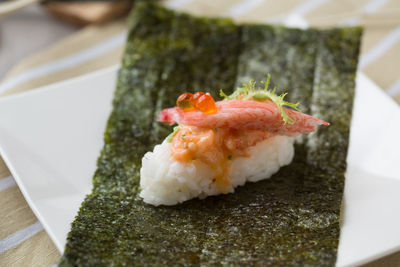 Close-up of sushi served on table