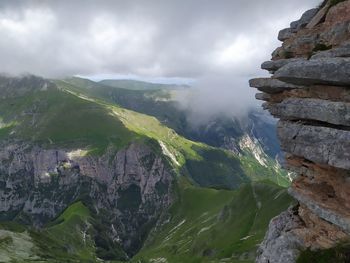 Panoramic view of rocks and mountains against sky