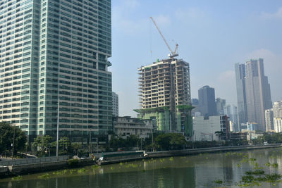 Modern buildings in city against sky