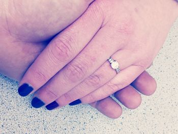 Cropped image of hand holding ring