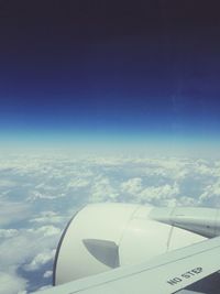 Cropped image of airplane over landscape