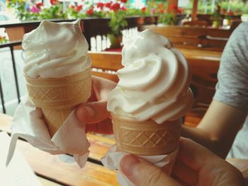 Close-up of hand holding ice cream