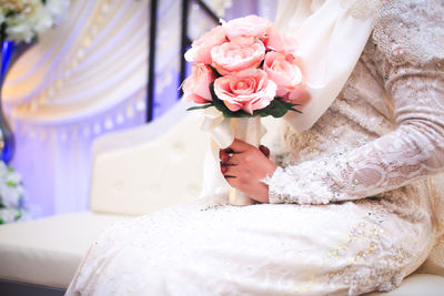 Beautiful bride with bouquet of flowers.