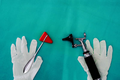 High angle view of equipment on blue wall