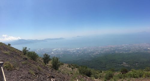 Scenic view of landscape against blue sky