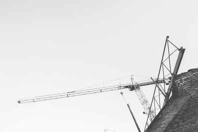 Low angle view of cables against clear sky