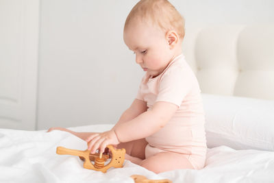 Cute baby playing on bed