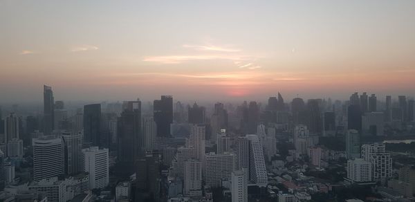 Cityscape against sky during sunset