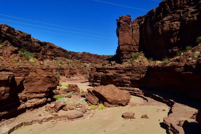 Rock formation on land against sky