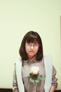 Portrait of beautiful woman against white background