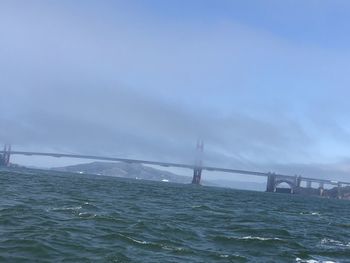 View of suspension bridge over sea