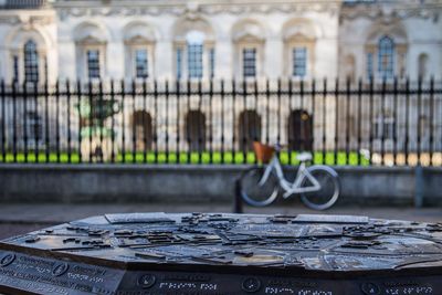 Close-up of motorcycle against building