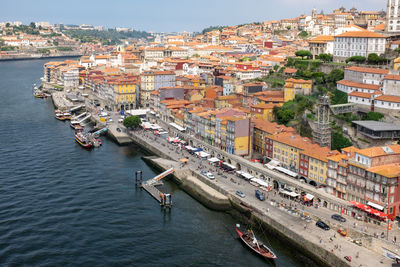 High angle view of river amidst buildings in town