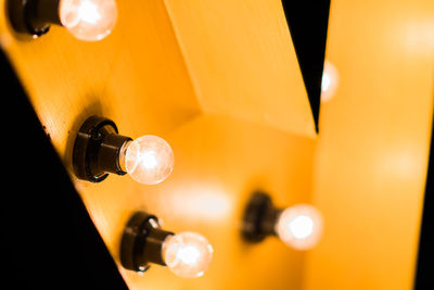 Close-up of illuminated light bulb