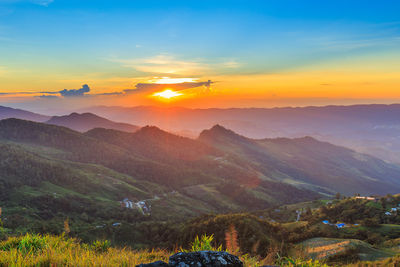 Scenic view of mountains against sky during sunset