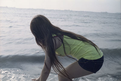 Side view of woman at beach