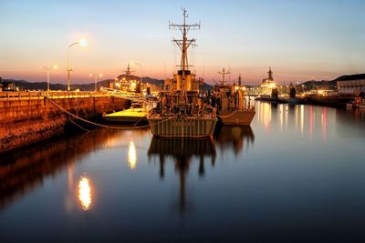 Boats moored at harbor