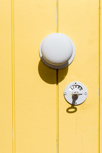 Close-up of arrow symbol on toilet house