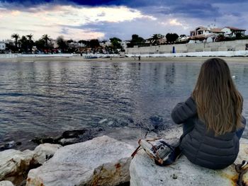 Rear view of woman on beach