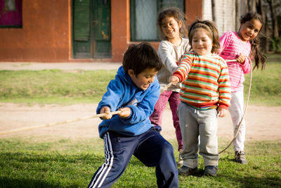 Girl playing with arms raised