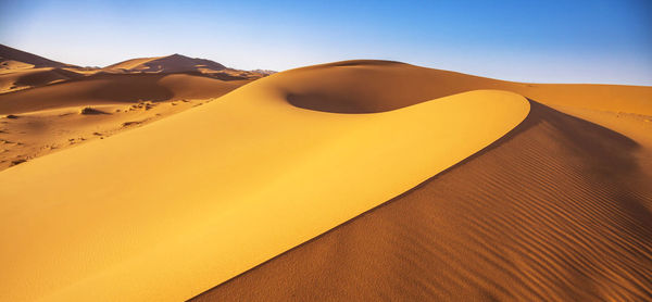 Scenic view of desert against clear sky