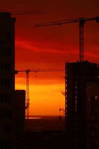 Silhouette building against sky during sunset