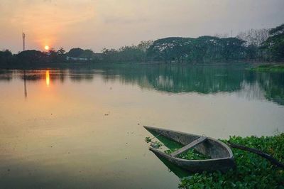 Scenic view of lake at sunset