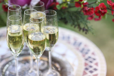 Close-up of wine glasses on table