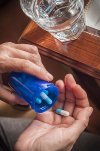 Close-up of person holding glass