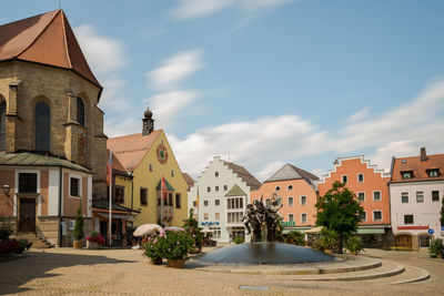 View of buildings in town against sky