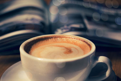 Close-up of coffee cup on table