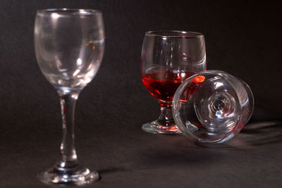 Close-up of wine glasses on table