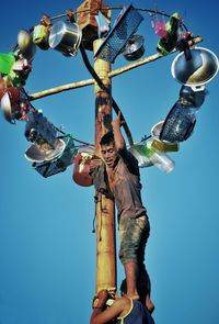 Low angle view of pole against clear sky