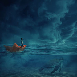 Digital composite image of man standing in paper boat on sea against sky at dusk