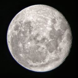 Low angle view of moon against sky at night