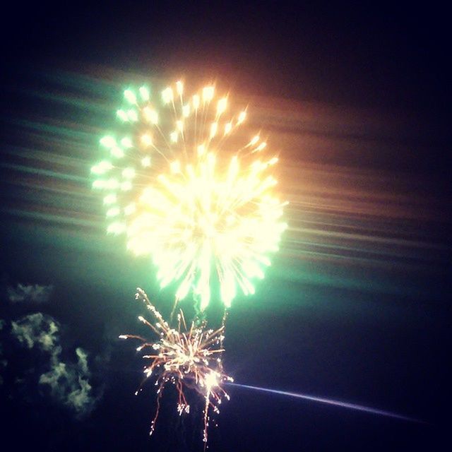 illuminated, firework display, night, celebration, exploding, glowing, firework - man made object, event, sparks, arts culture and entertainment, long exposure, firework, low angle view, motion, entertainment, sky, blurred motion, fire - natural phenomenon, celebration event, light - natural phenomenon