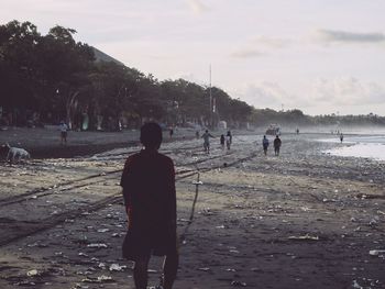 View of people standing on beach