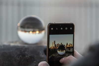 Close-up of hand holding smart phone