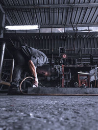 Surface level of man working in workshop